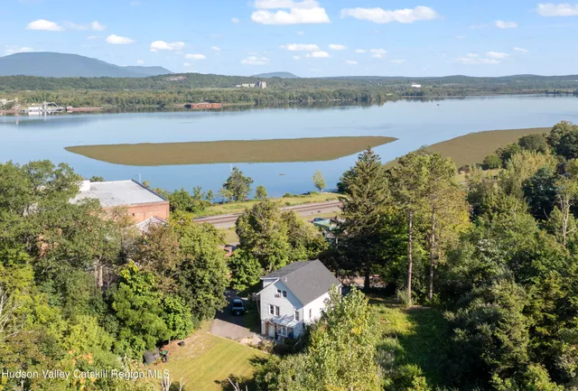 a view of a lake with houses in the back