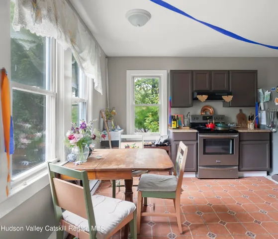 a kitchen with a table and chairs in it