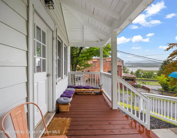 a view of a balcony with chairs