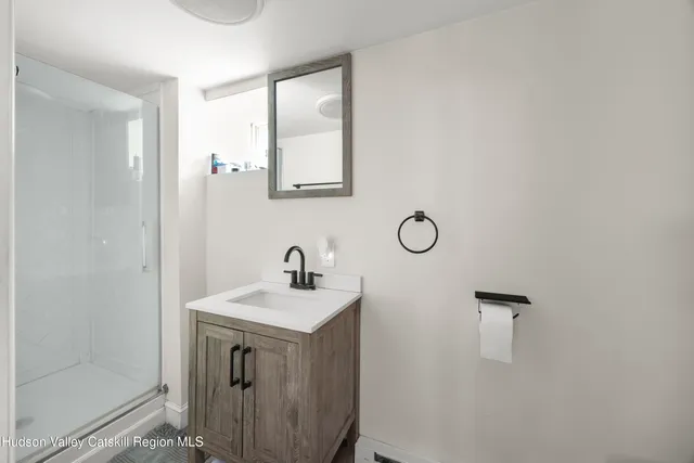 a bathroom with a sink a vanity and a mirror