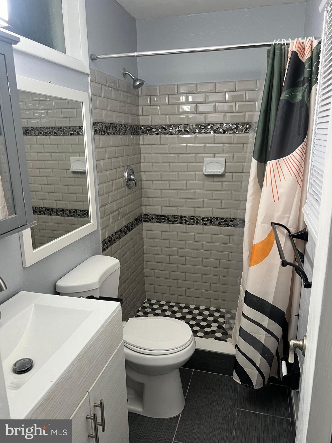 11321 College View Drive Silver Spring, MD 20902 - Photo 23 of 83 Moden beautifully tiled shower and matching floors