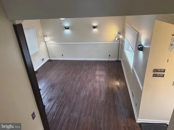 a bathroom with a sink a toilet a mirror and vanity