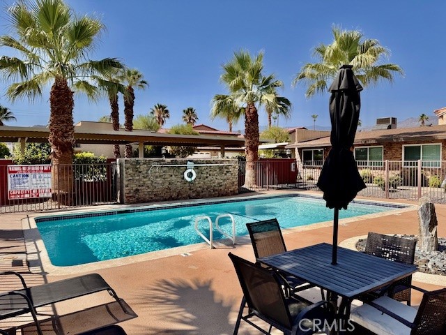 74402 Abronia, Unit 7 Palm Desert, CA 92260 - Photo 2 of 15 a view of a chairs and table in the patio