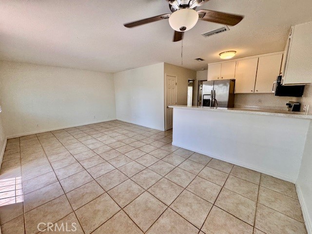 74402 Abronia, Unit 7 Palm Desert, CA 92260 - Photo 5 of 15 a view of a kitchen with a sink and cabinets