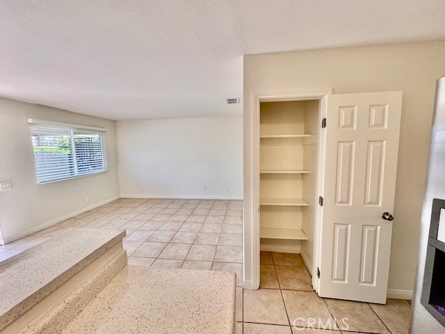 74402 Abronia, Unit 7 Palm Desert, CA 92260 - Photo 6 of 15 a view of an empty room and window