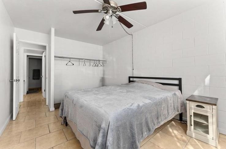 111 Kahului Beach Road, Unit B112 Kahului, HI 96732 - Photo 7 of 15 a bedroom with a bed and a chandelier