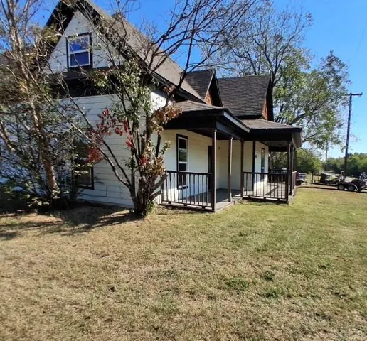 a view of a house with a garden