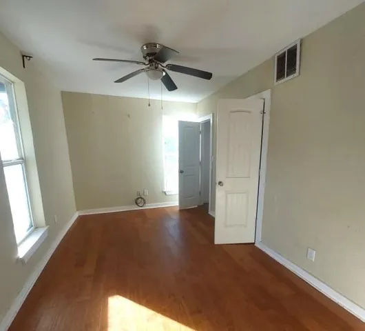 a view of an empty room and window