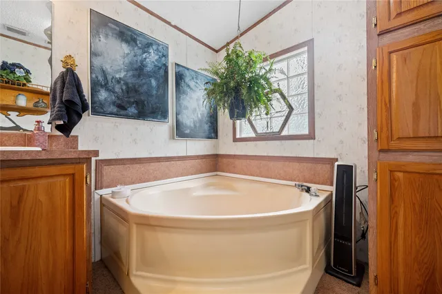 a bathroom with a tub and sink