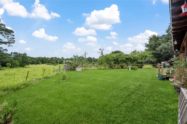 a view of a lake with houses in the back