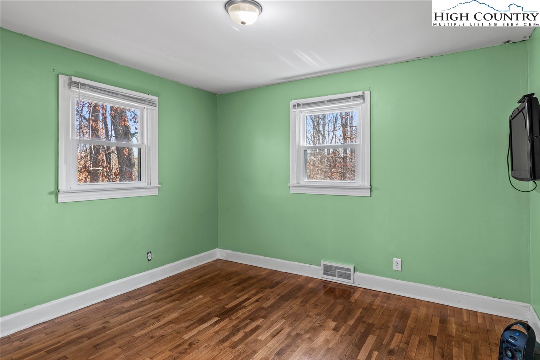 133 South Street Elkin, NC 28621 - Photo 15 of 24 a view of a room with wooden floor and window