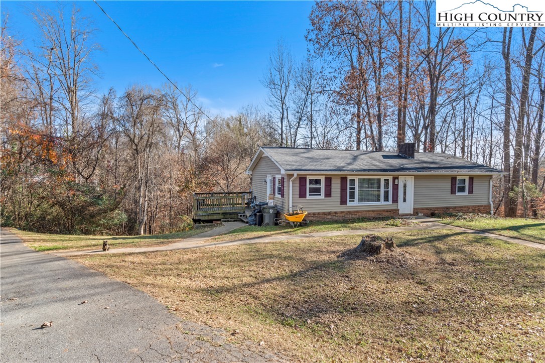 133 South Street Elkin, NC 28621 - Photo 2 of 24 a view of a house with a yard covered in snow