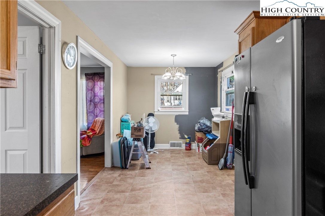 133 South Street Elkin, NC 28621 - Photo 9 of 24 a view of a hallway with workspace and living room