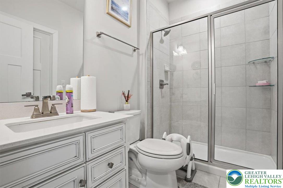 3902 Orth Street Bethlehem, PA 18020 - Photo 22 of 62 a bathroom with a sink a toilet and shower