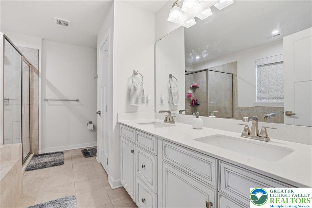 3902 Orth Street Bethlehem, PA 18020 - Photo 28 of 62 a bathroom with a double vanity sink mirror and double