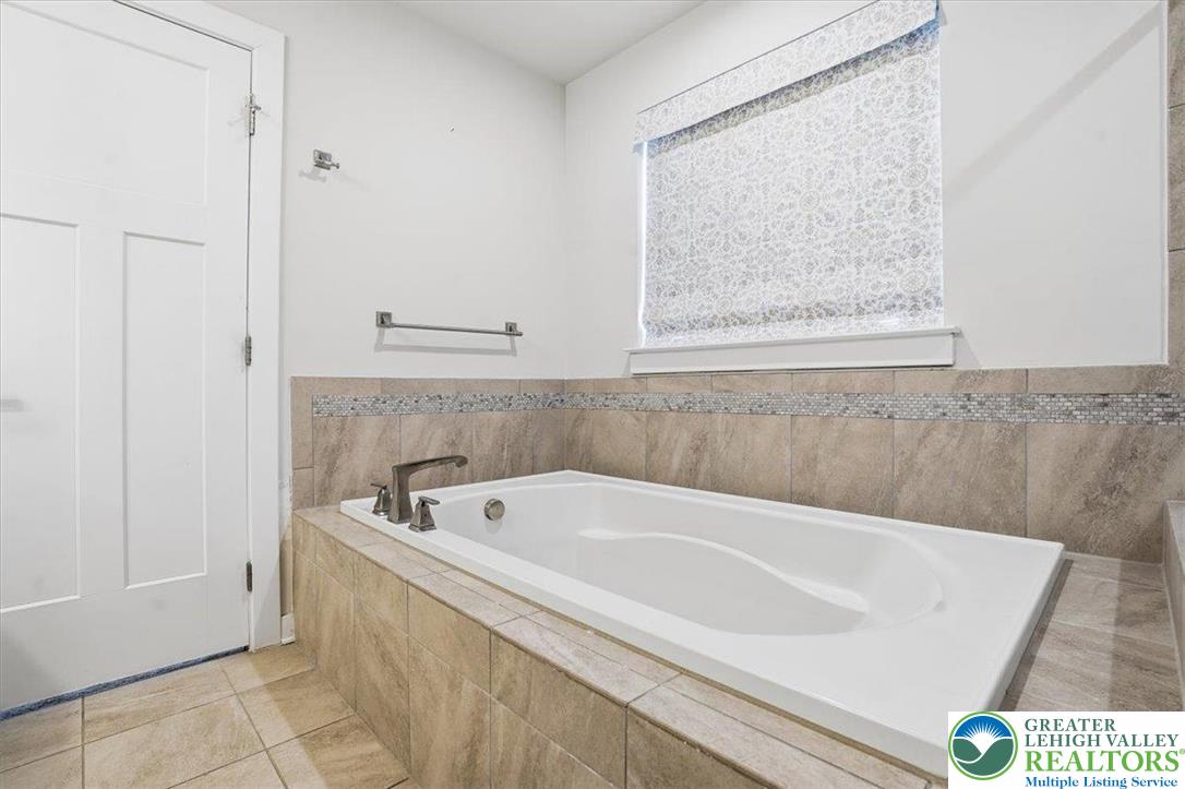 3902 Orth Street Bethlehem, PA 18020 - Photo 29 of 62 a bath tub sitting next to a white sink