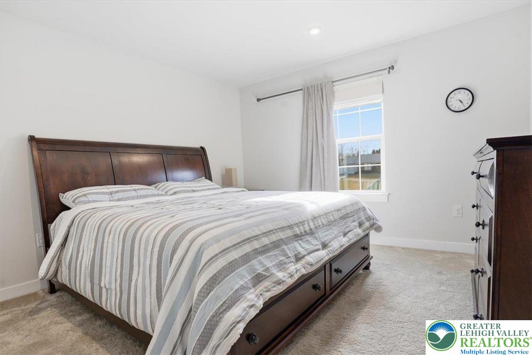 3902 Orth Street Bethlehem, PA 18020 - Photo 31 of 62 a bed sitting in a bedroom next to a window