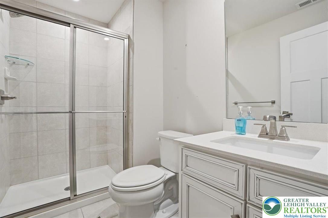 3902 Orth Street Bethlehem, PA 18020 - Photo 40 of 62 a bathroom with a sink toilet and shower