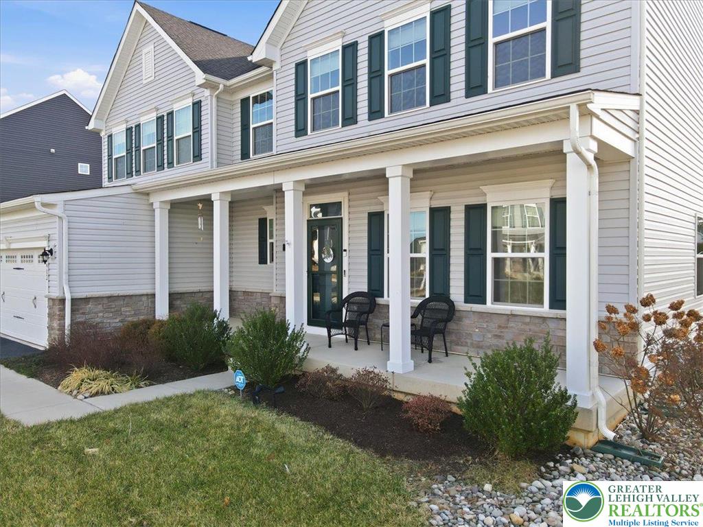 3902 Orth Street Bethlehem, PA 18020 - Photo 55 of 62 front view of a brick house with a yard