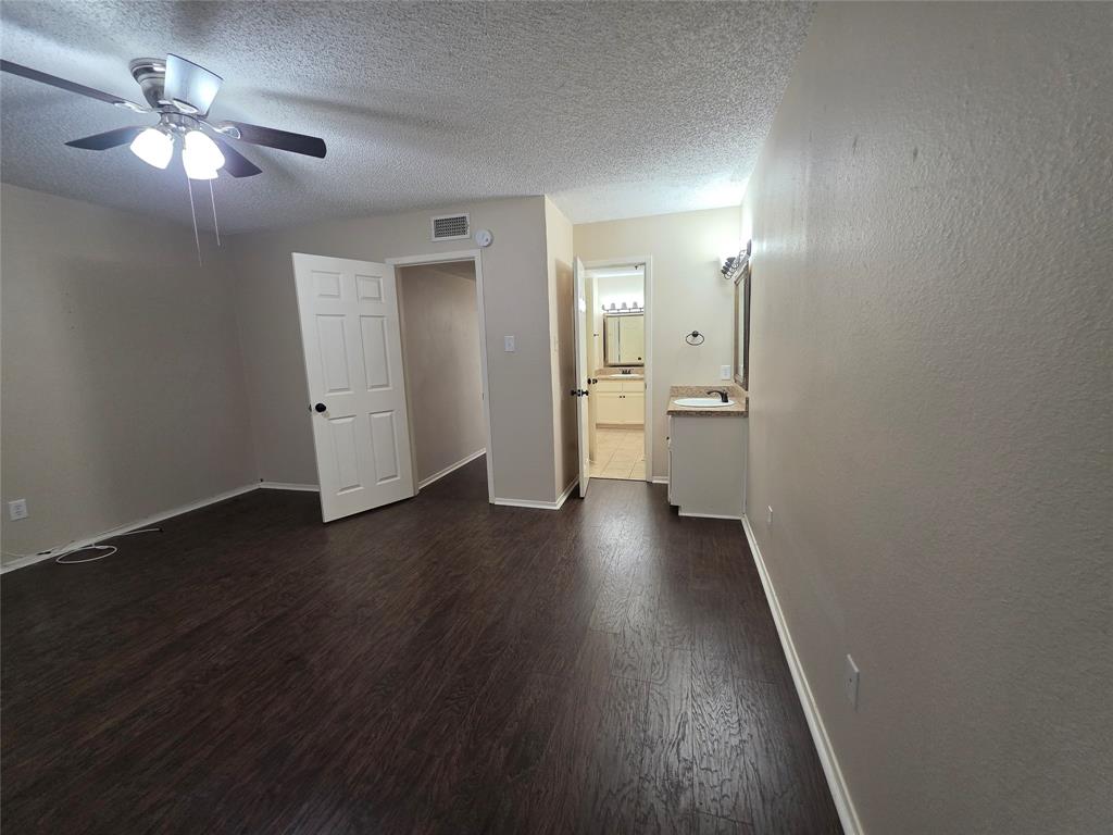 620 Race Street, Unit D Crowley, TX 76036 - Photo 15 of 20 wooden floor in an empty room with a window