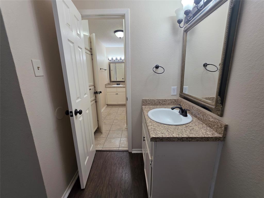 620 Race Street, Unit D Crowley, TX 76036 - Photo 20 of 20 view of a bathroom sink and mirror
