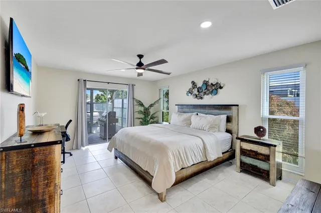 a spacious bedroom with a bed and a desk