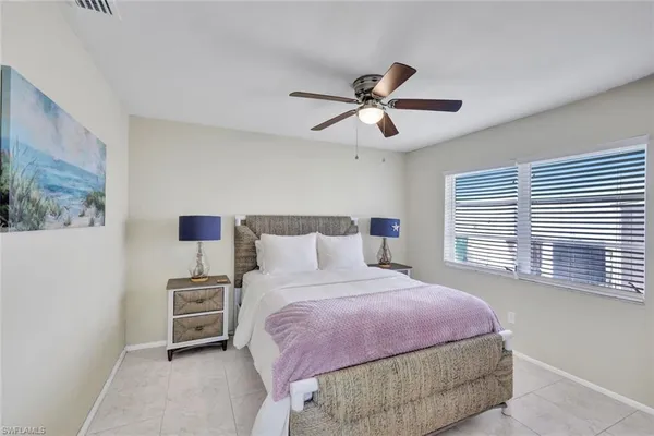 a bedroom with a bed dresser and a window