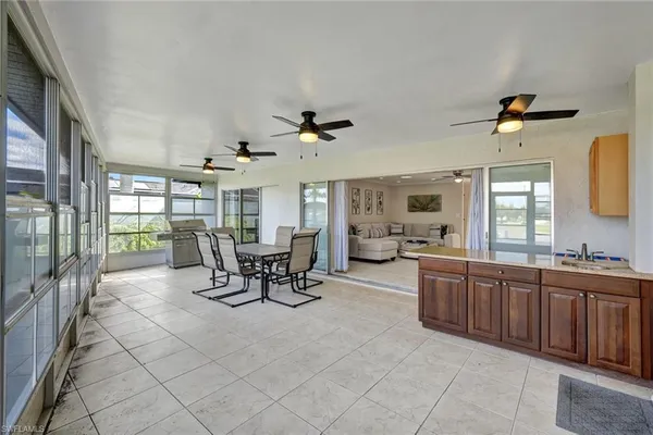 a view of a dining room and hall with furniture