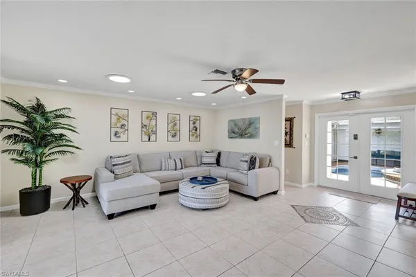 a living room with furniture a chandelier