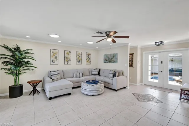 a living room with furniture a chandelier