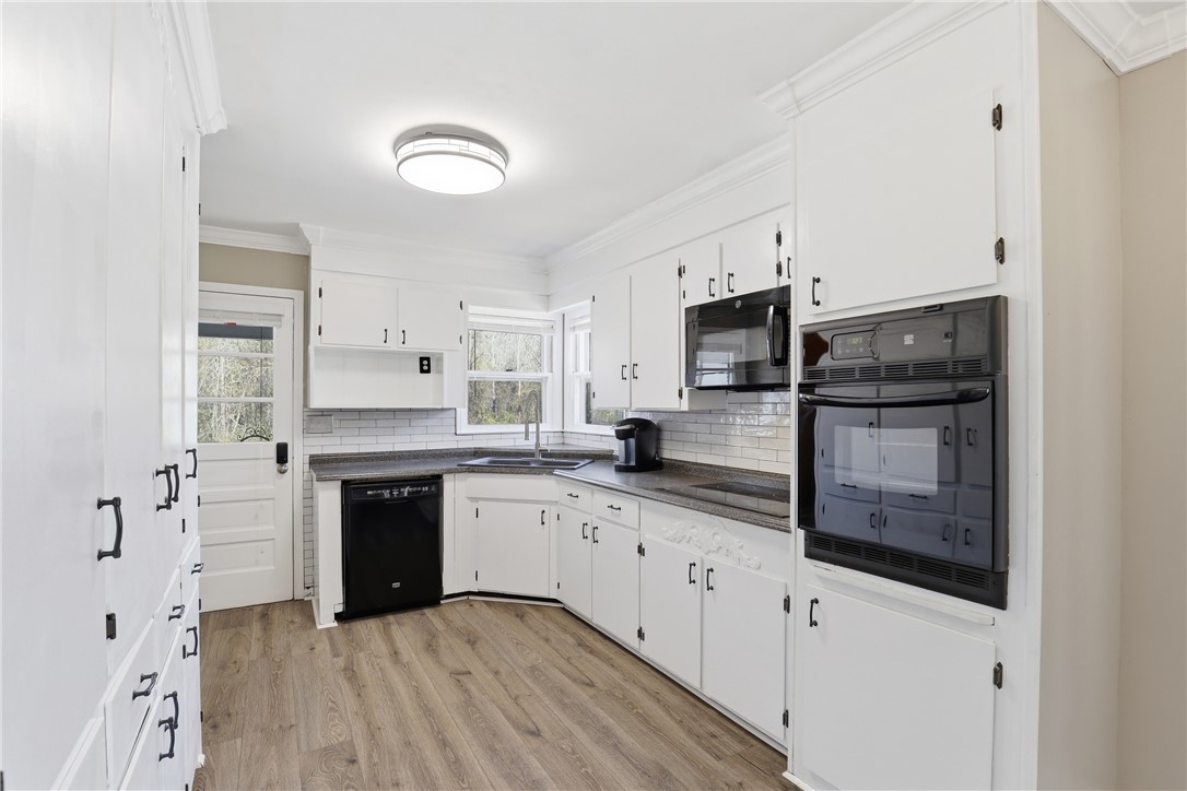 4304 Old Buncombe Road Greenville, SC 29617 - Photo 9 of 49 This spacious kitchen offers ample storage and a bright, functional layout.