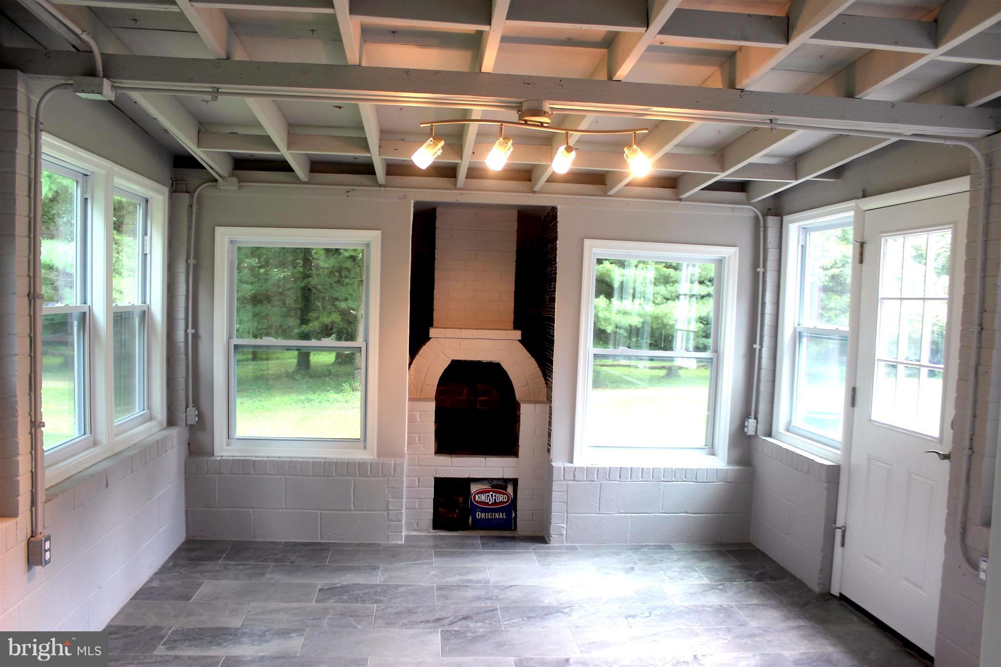 1715 Ballenger Creek Pike Point of Rocks, MD 21777 - Photo 22 of 30 Walls of windows in 3-season sunroom room