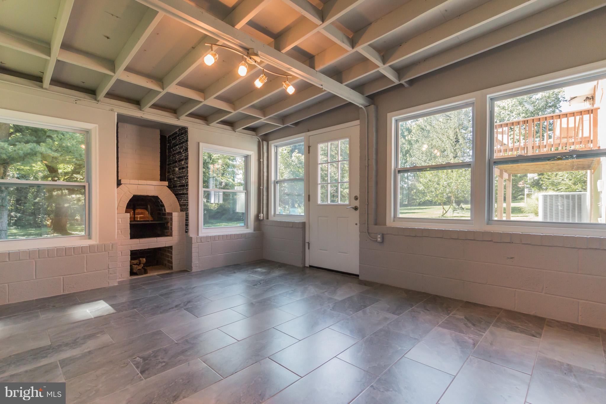 1715 Ballenger Creek Pike Point of Rocks, MD 21777 - Photo 23 of 30 Sunroom has cosy fireplace or use as grill