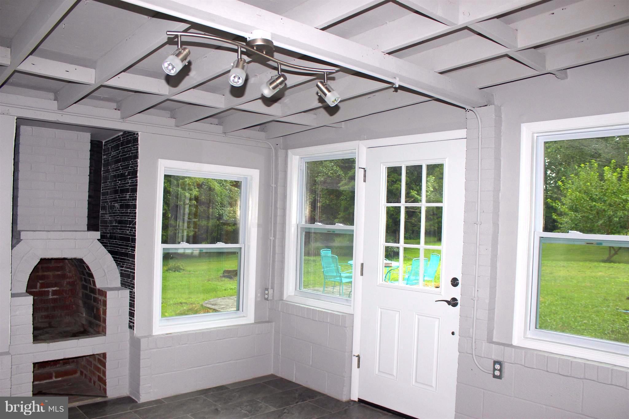 1715 Ballenger Creek Pike Point of Rocks, MD 21777 - Photo 24 of 30 Exit 3-season room to new rear patio & 1-acre