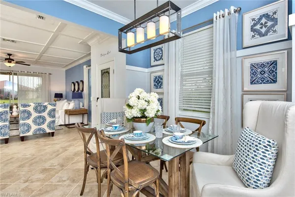 a dining room with furniture and window
