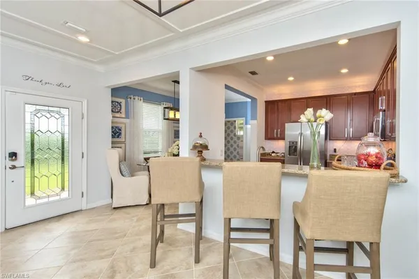a view of a livingroom with a ceiling fan and window