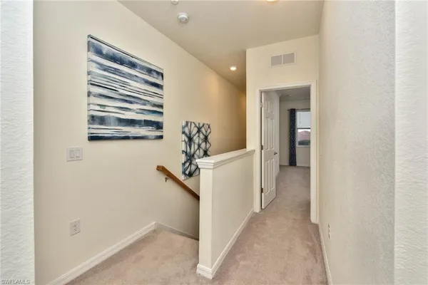 a view of a livingroom with a ceiling fan and window
