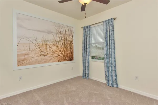 a bathroom with double vanity and a mirror
