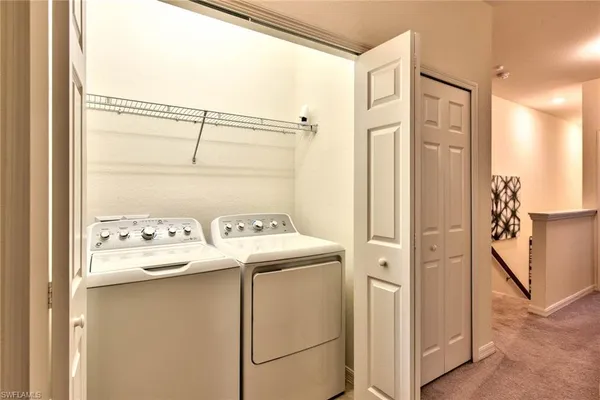 a outdoor living space with furniture and a floor to ceiling window