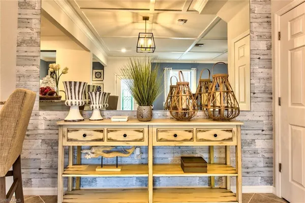 a view of a dining room with furniture and chandelier