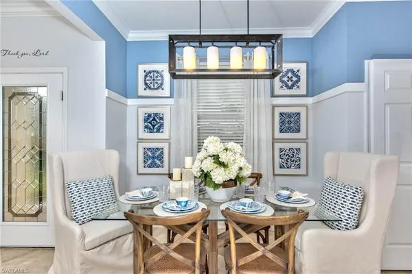 a kitchen with stainless steel appliances kitchen island granite countertop a stove a sink and a refrigerator