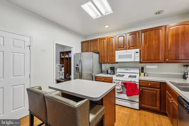 a kitchen that has a cabinets and a stove top oven