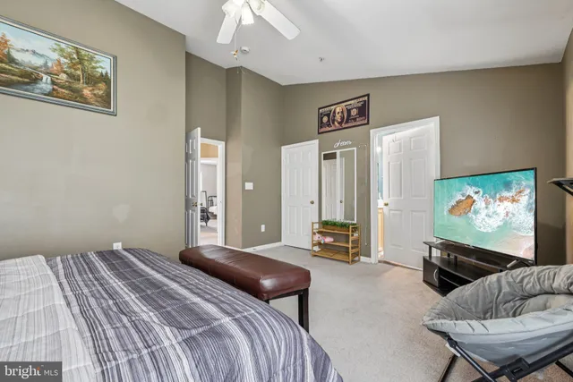 a bedroom with a bed and a couch