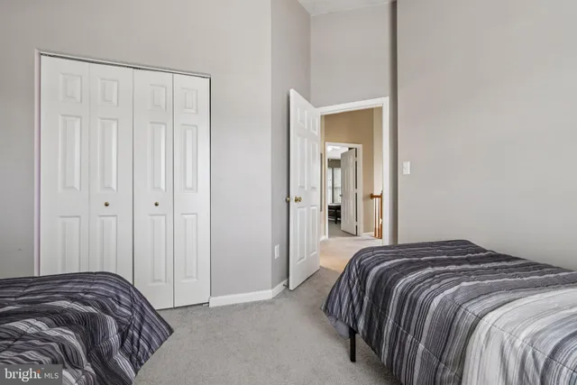 a bedroom with a bed and a mirror