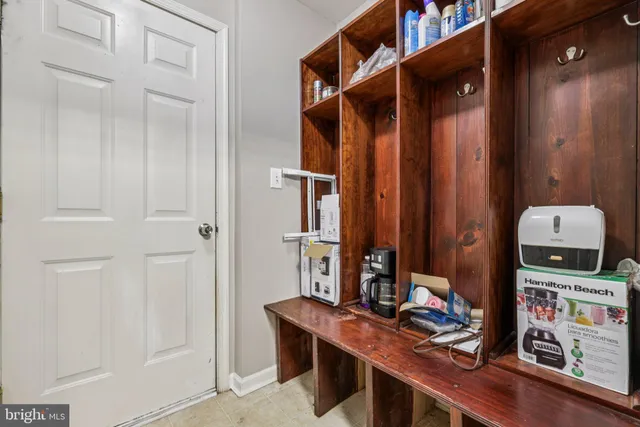 a view of a workspace with furniture and a gate