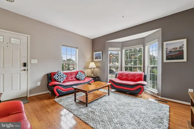 a living room with furniture and a rug