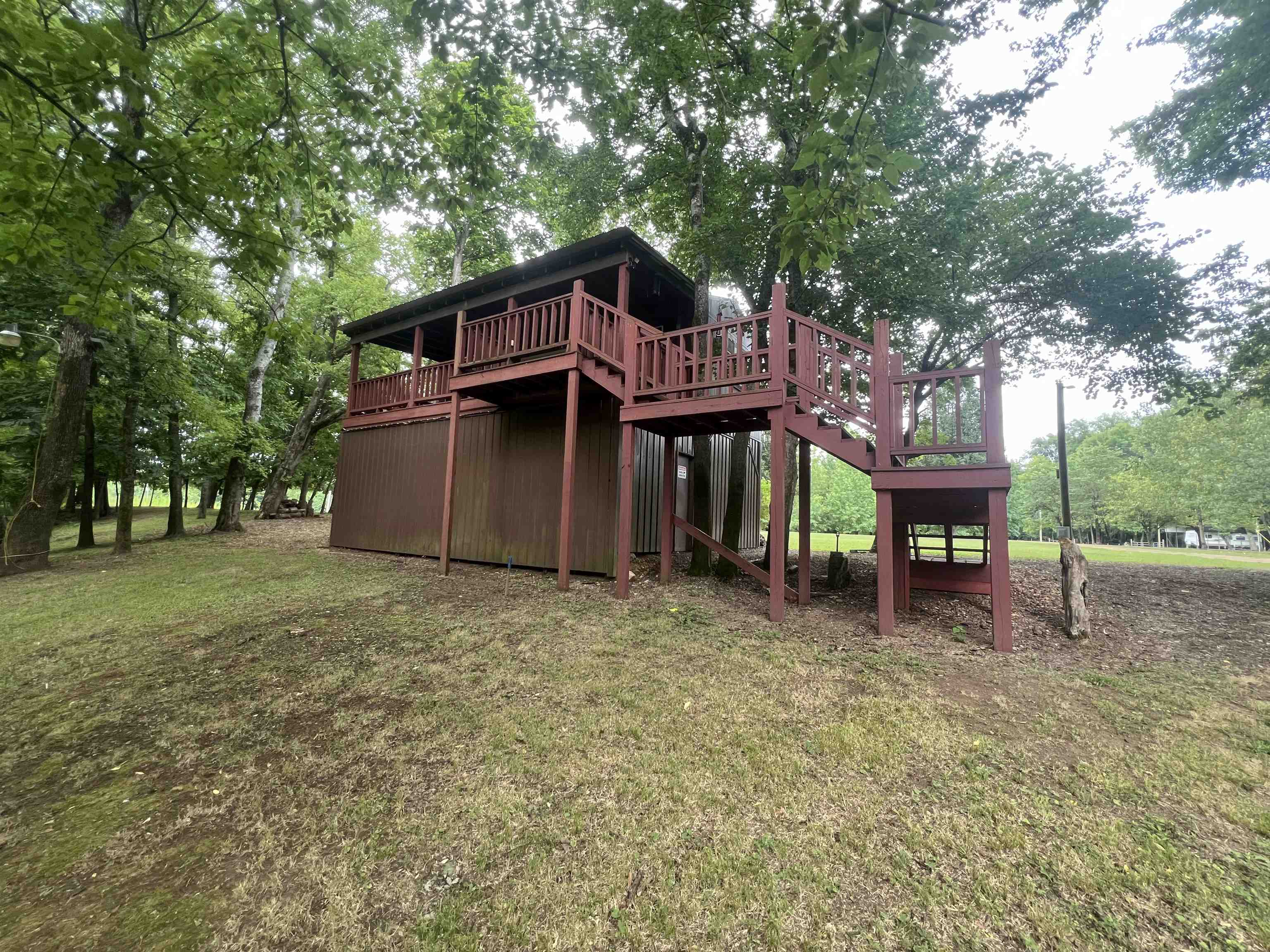 590 Towboat Lane Adamsville, TN 38310 - Photo 22 of 39 a front view of a house with garden