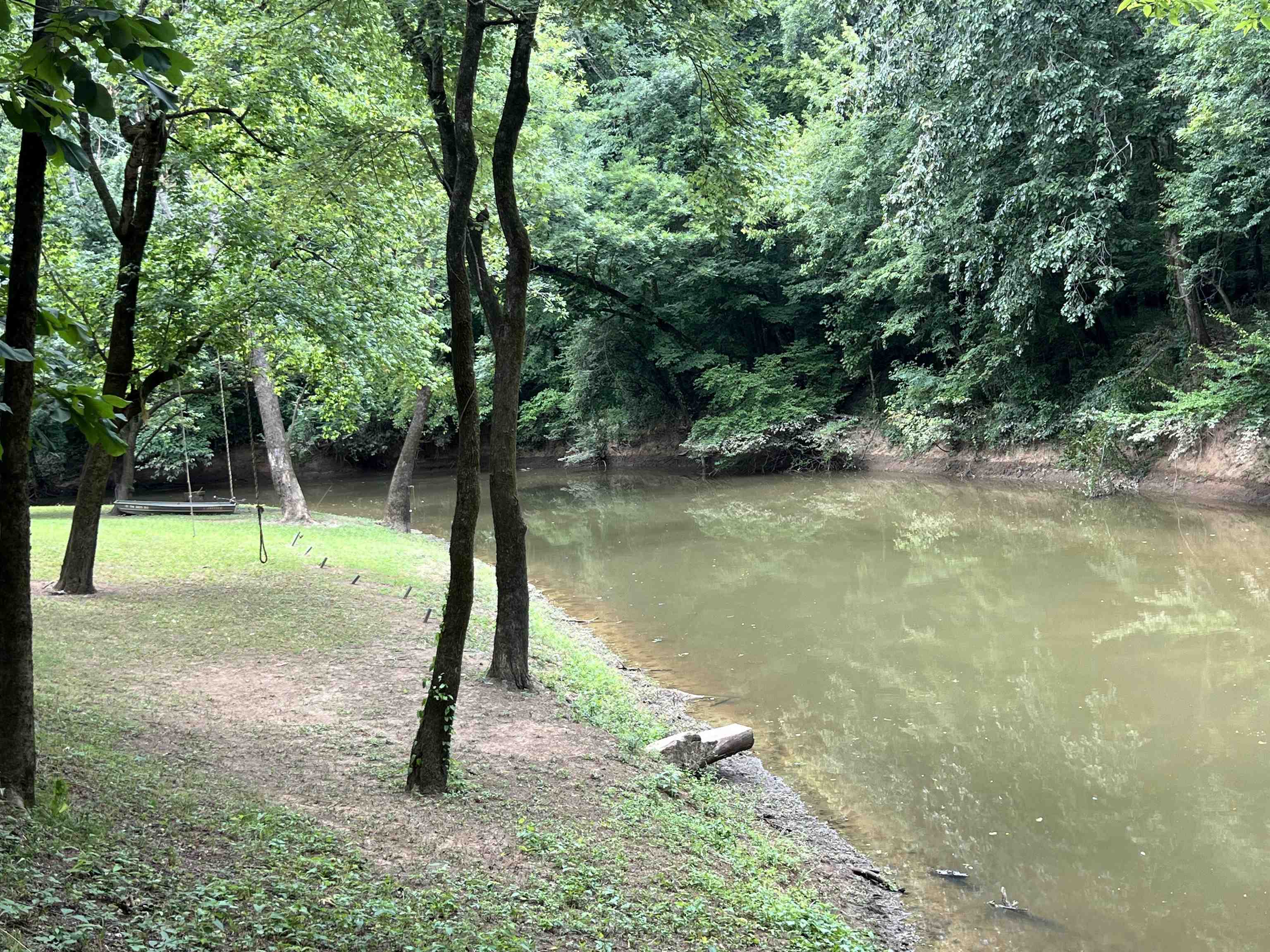 590 Towboat Lane Adamsville, TN 38310 - Photo 33 of 39 a backyard of a house with lots of green space