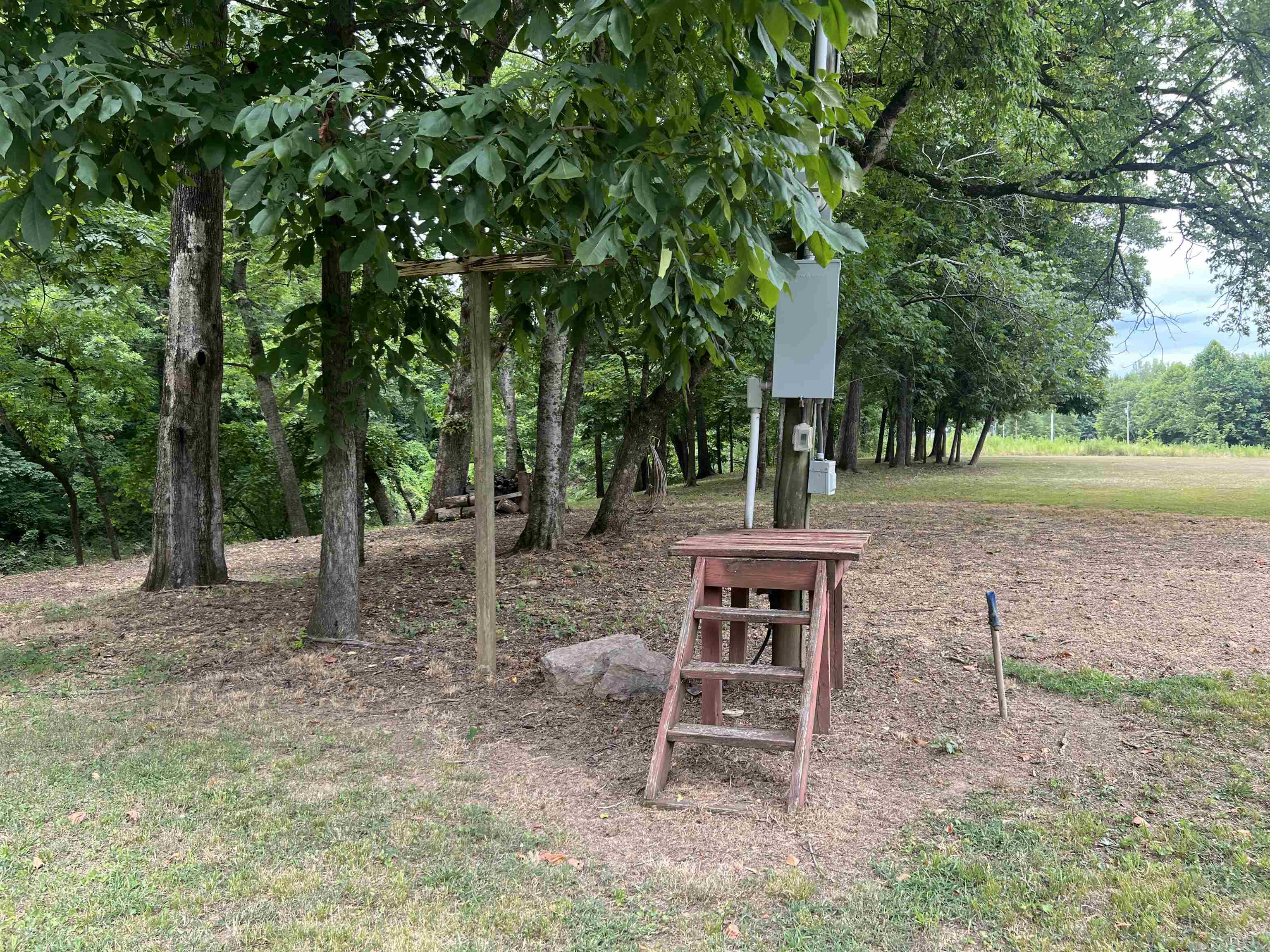590 Towboat Lane Adamsville, TN 38310 - Photo 37 of 39 a table and chairs sitting in the middle of the yard