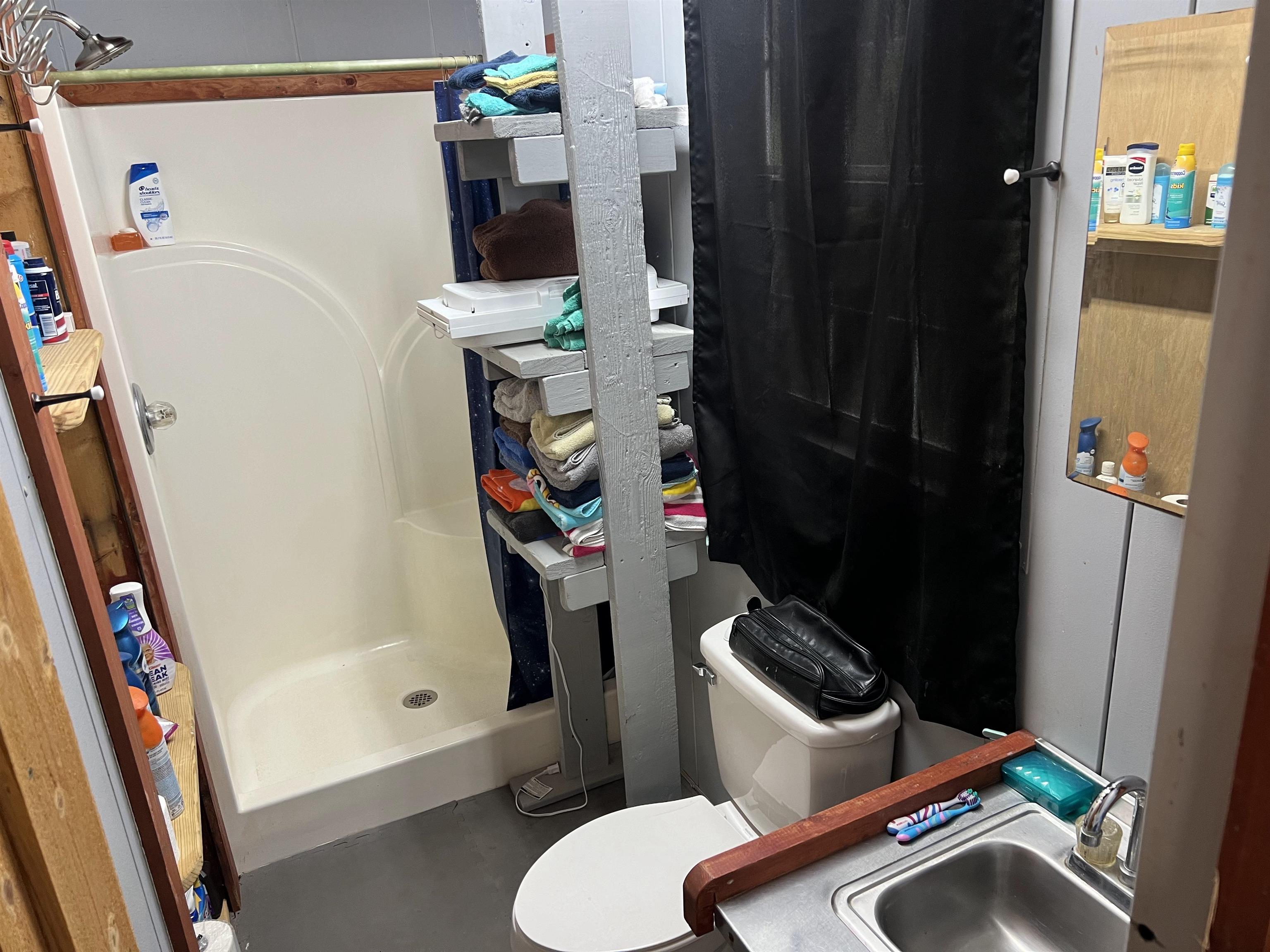 590 Towboat Lane Adamsville, TN 38310 - Photo 8 of 39 Bathroom with walk in shower and toilet
